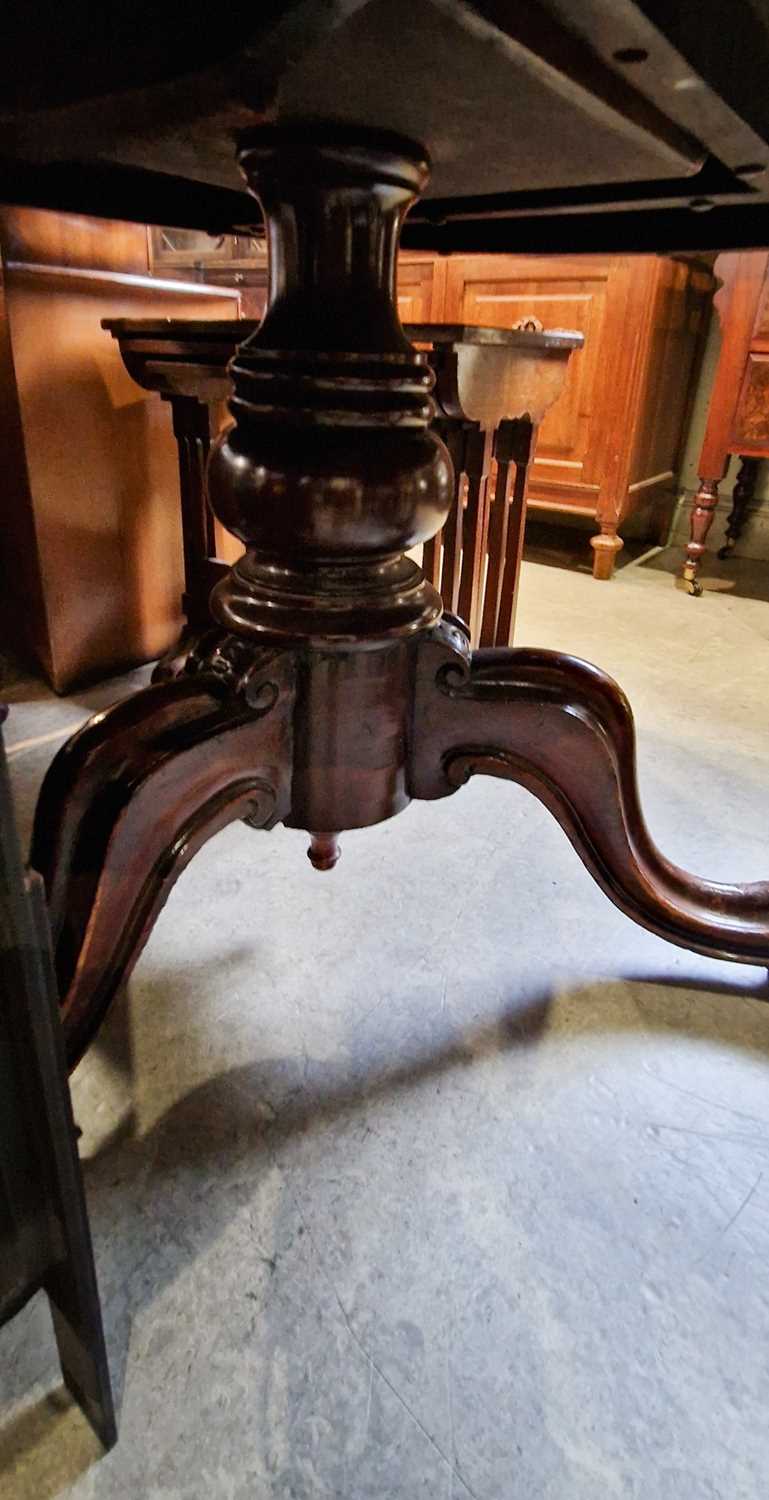 A Victorian mahogany snap-top pedestal supper table, 120cm diameter x 70cm high. - Image 2 of 2