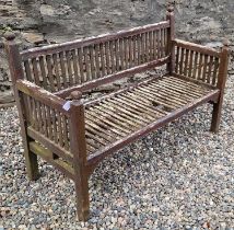 A wooden garden bench, 139cm wide.