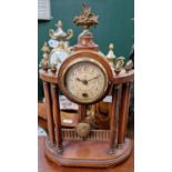 A mahogany mantle clock with floral basket centre finial and six acorn finials above six full