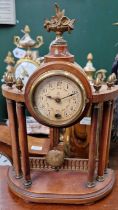 A mahogany mantle clock with floral basket centre finial and six acorn finials above six full