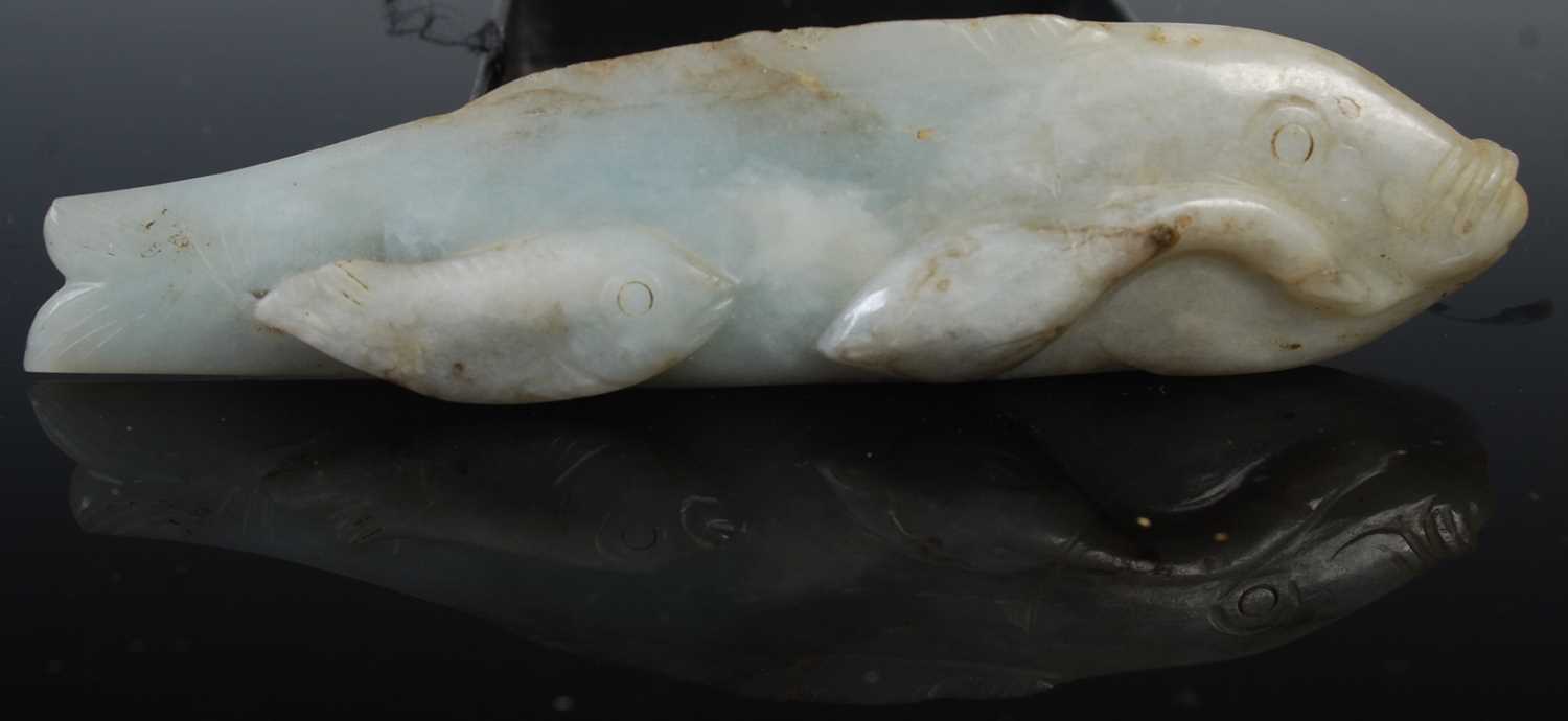 A Chinese jade model of a fish and fingerlings, 12cm long, 84.6 grams.