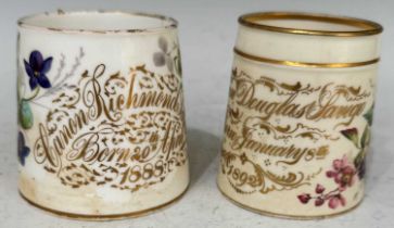 Two late 19th century porcelain hand-painted christening mugs, the first with gilded inscription '