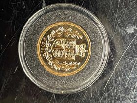 A 2002 Elizabeth II gold sovereign.