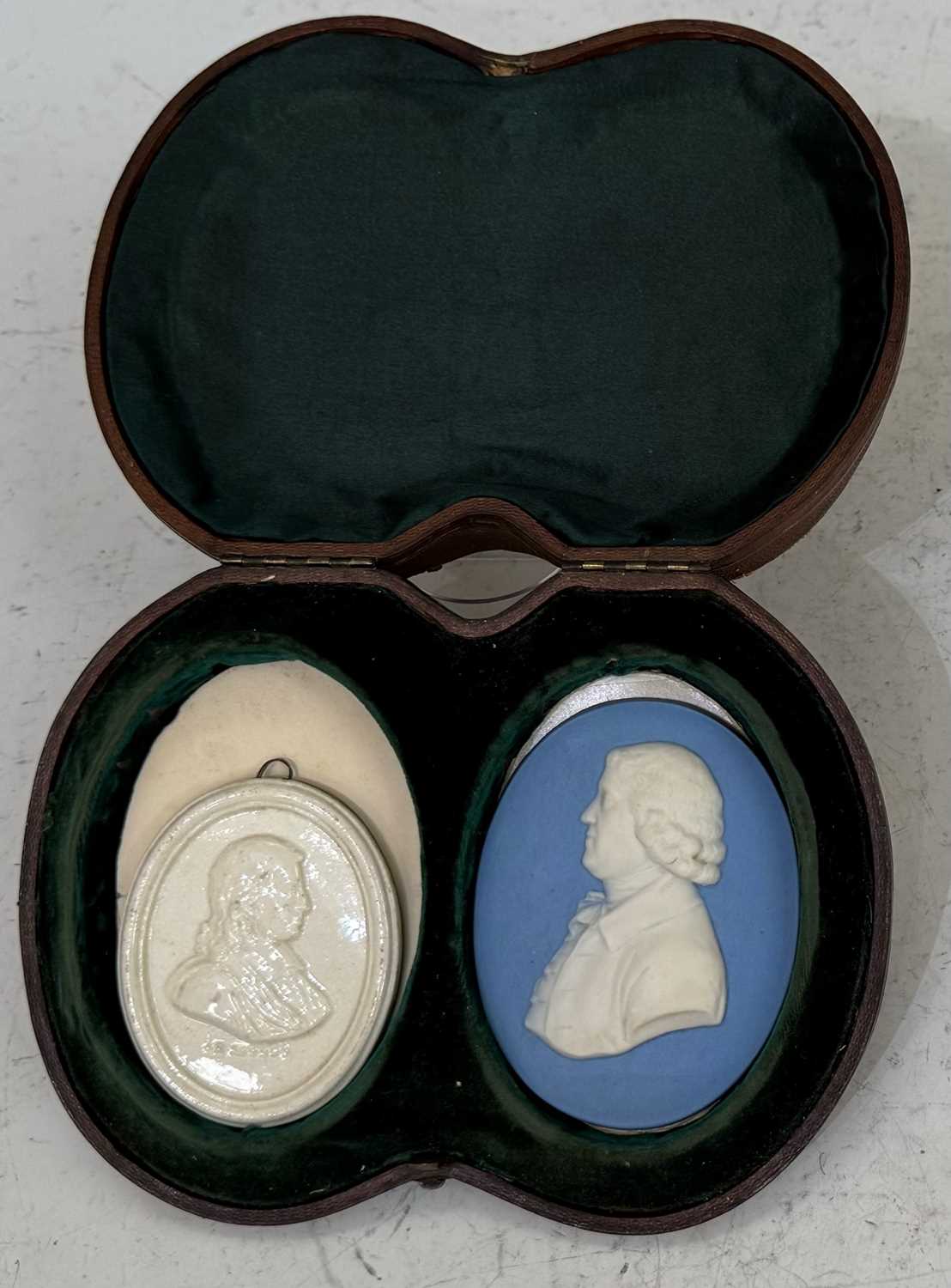 An antique Wedgwood blue ground Jasper Ware portrait medallion 8.3cm by 6.5cm; together with a Leeds