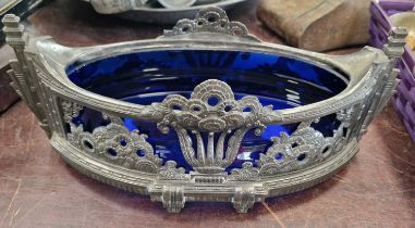 An early 20th century Art Deco pewter table centrepiece with Bristol blue glass liner, the underside
