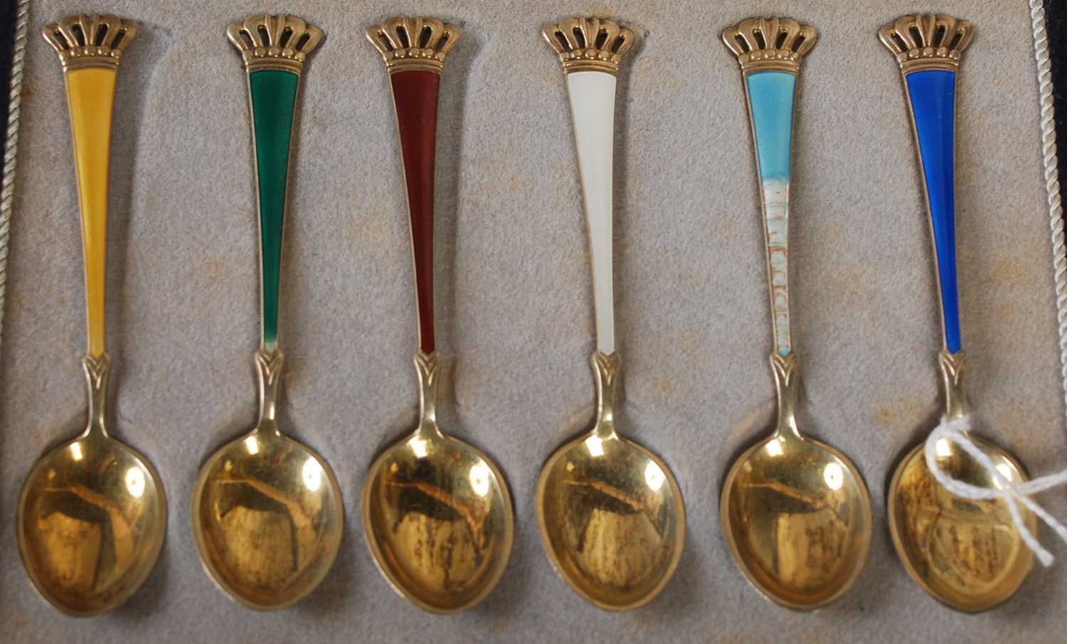 A cased set of six Danish sterling silver gilt and enamel coffee spoons. - Image 2 of 2