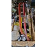 A wicker basket containing assorted tools to include spanners, saws, dowel mate, dove tailer, two