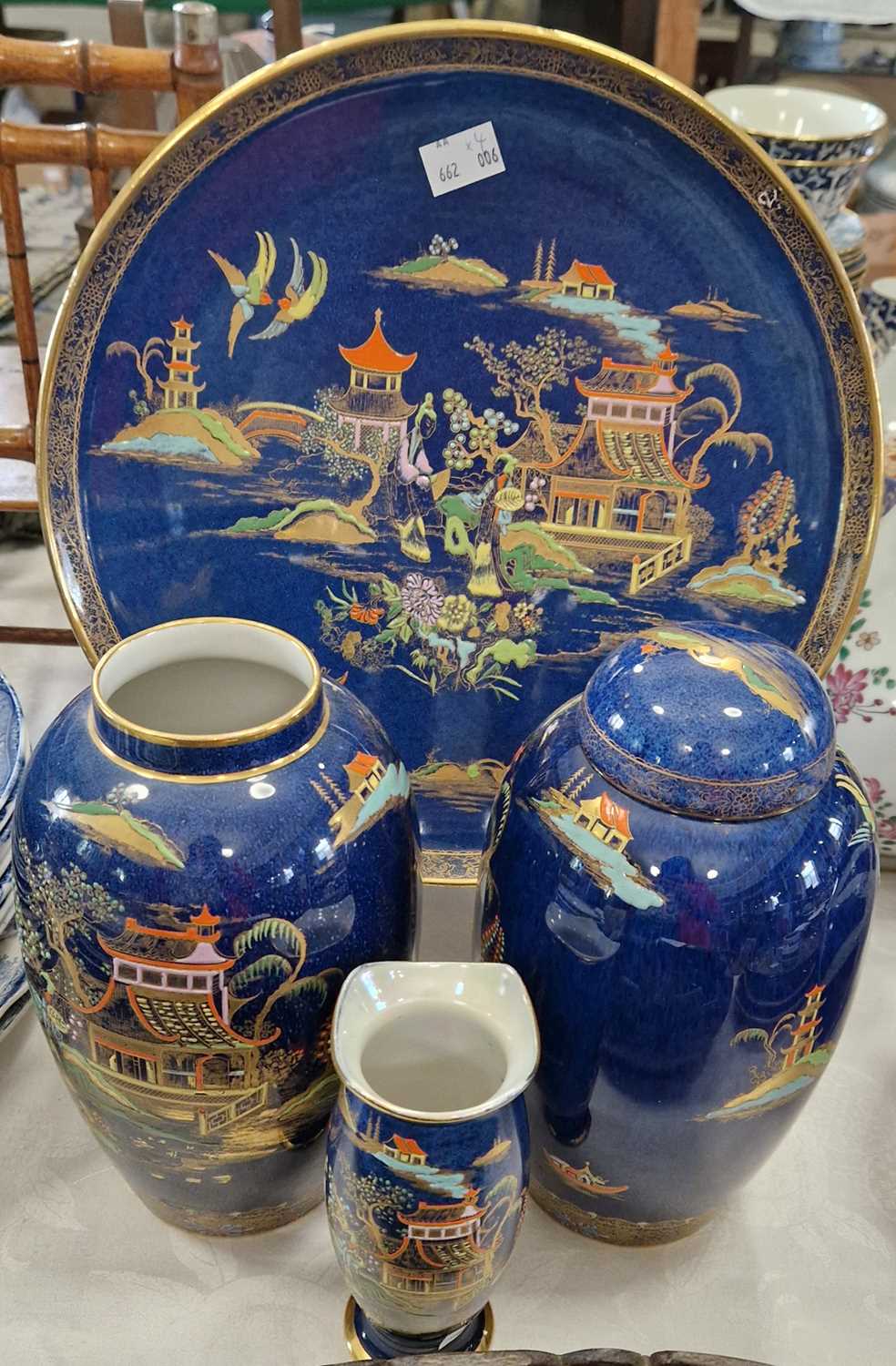 Four pieces of 'Chinaland' pattern Carlton Ware, a plate, vase and two jars, one with cover and