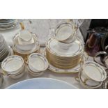 An Aynsley china part tea set with black border and richly gilded accents