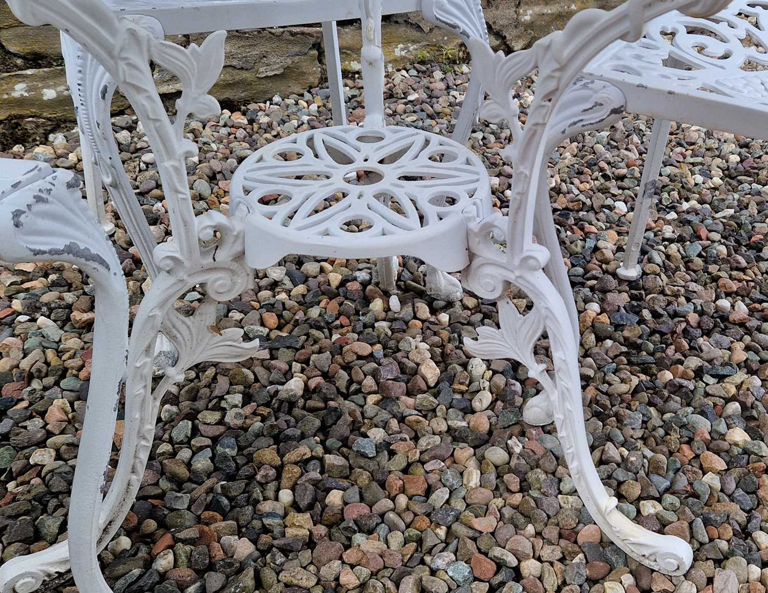 A white-painted cast metal garden table and three chairs, the table 81cm diameter. - Image 5 of 5