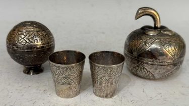 A group of Eastern white metal wares to include an apple shaped box and cover, a circular shaped box