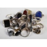 A collection of fifteen assorted silver and white metal dress rings.