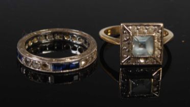 An early 20th century blue and white sapphire set white metal eternity ring, stamped 9CT, ring