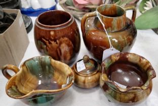 A group of four Dunmore green & brown glazed pottery items, each with impressed 'Dunmore' mark,