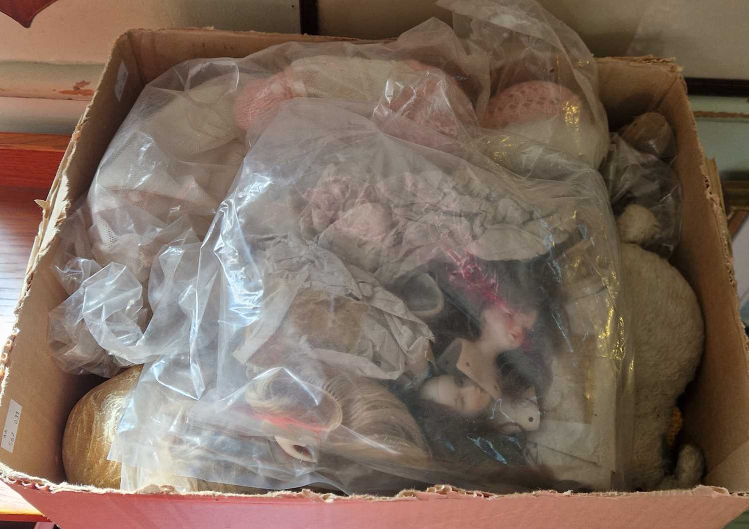 A box of assorted vintage dolls, to include a bag containing various bisque headed doll busts.