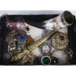 A box of assorted odds to include carved horn, a brass dagger, costume jewellery, purple glass