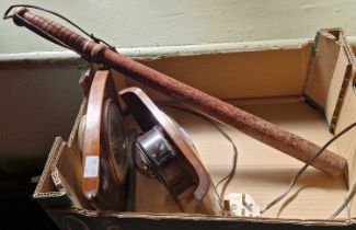 A vintage wooden baton and two mantle clocks.