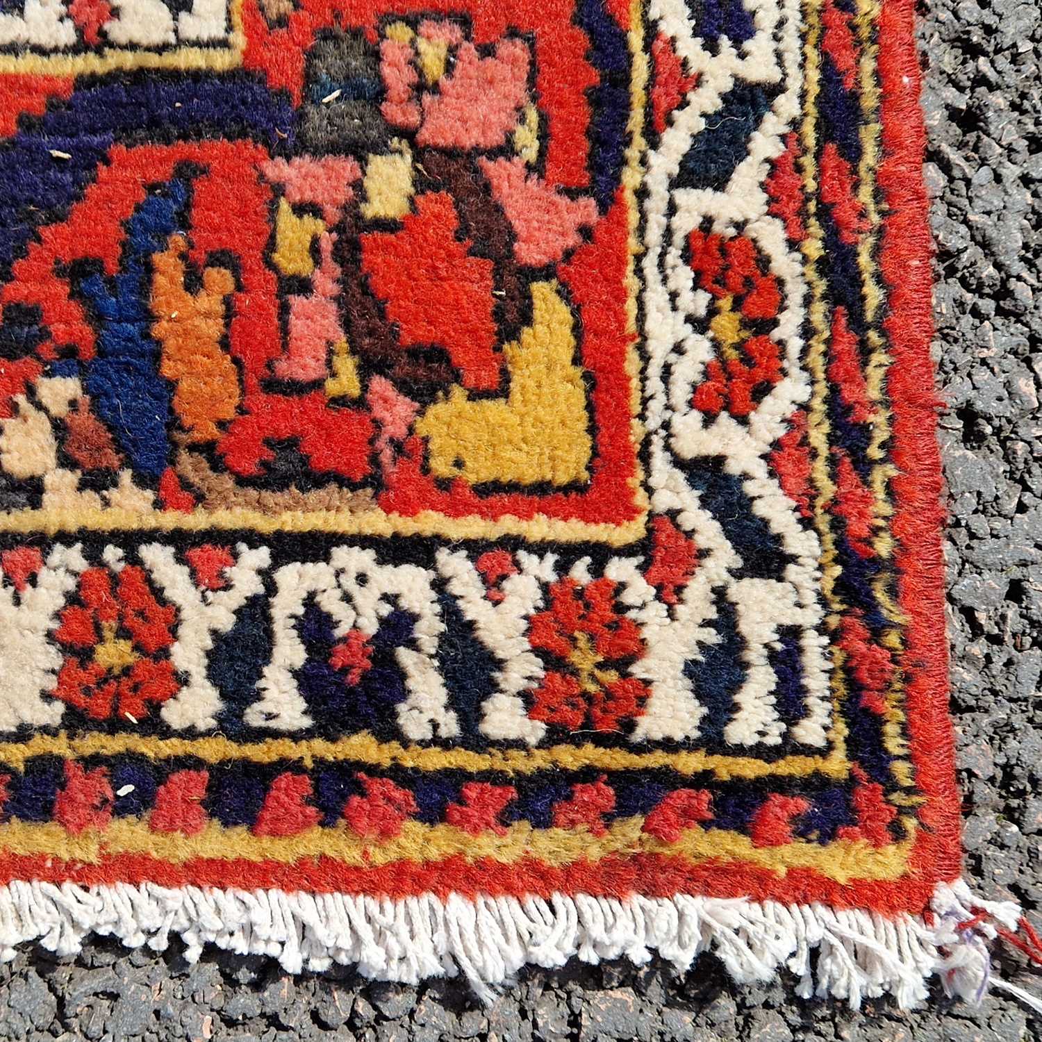 A Persian rug, 20th century, the rectangular madder ground centered with a blue ground oval - Image 3 of 5