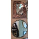 An early 20th century Arts & Crafts copper wall mirror, the frame embossed with acorns and