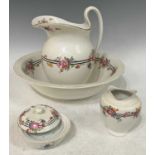 A late 19th century hand-painted part wash set comprising ewer, basin, soap dish and toothbrush