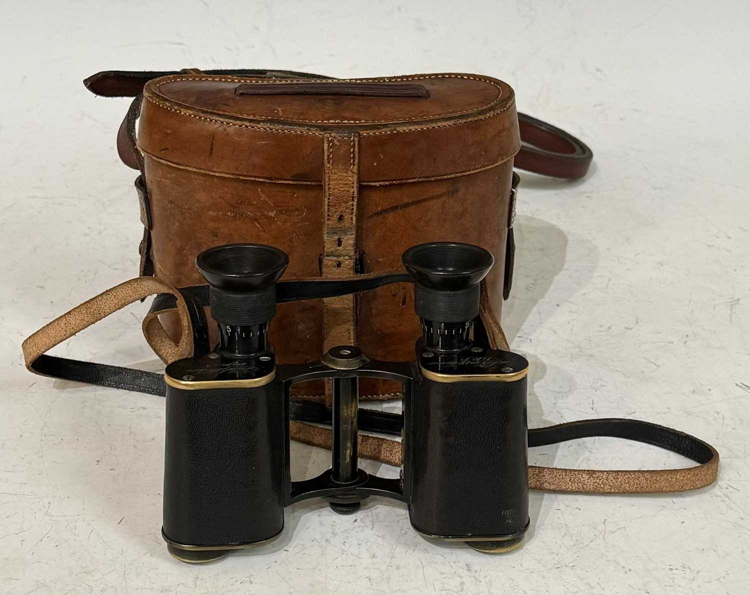 A late 19th/early 20th century leather cased set of Carl Zeiss Jena D.R.P. Feldstrecher Vergr +8