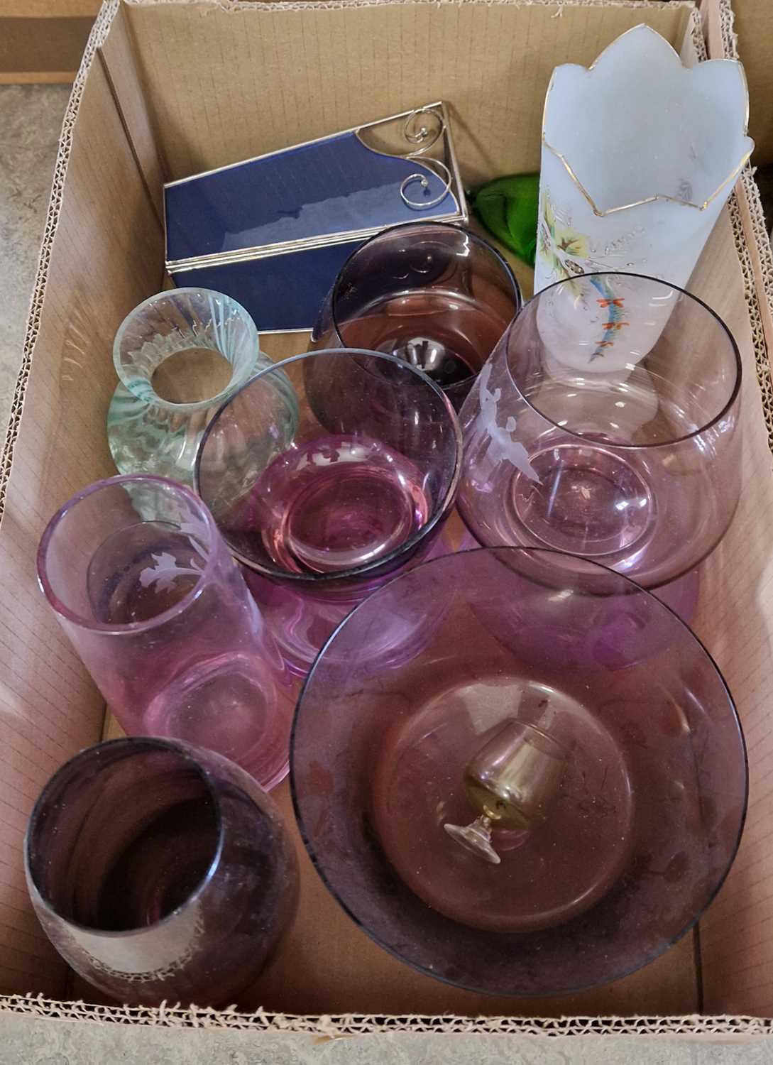 A box of assorted coloured art glassware.