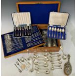 A collection of EPNS to include an oak part canteen of cutlery, a cased set of six dessert forks