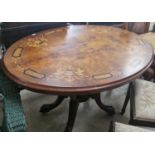 A walnut and marquetry inlaid oval snap-top table (lacking pins), 118cm wide.