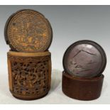 A Chinese carved bamboo cylindrical storage jar and cover, the carved panels depicting phoenix birds