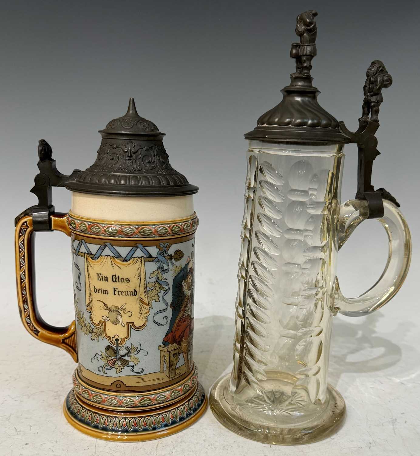 A Mettlach German pottery Beer Stein with pewter hinged cover, decorated with two medieval figures