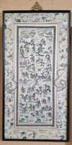 A Chinese silkwork panel / kesi, worked in coloured threads to depict various figures, flowers and