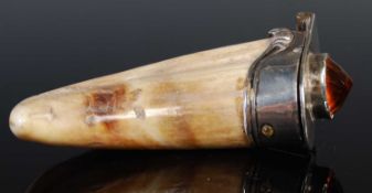 A 19th century white metal mounted boar tusk carved snuff mull, the hinged cover set with faceted