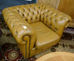 Tan square Chesterfield chair