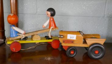 1950's pull along toy together with a tractor