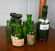 Collection of apothecary green glass bottles