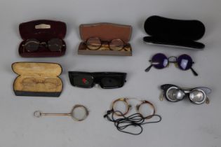 An assortment of eye glasses and spectacles