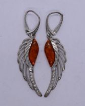 Pair of silver and amber earrings