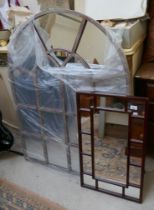 Large arched window framed mirror together with another