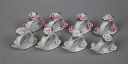 8 ceramic napkin rings adorned with roses