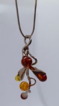 Silver and amber pendant on chain