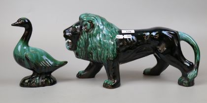 Large glazed ceramic lion and duck figure - Approx height 22cm Length of lion approx 43cm