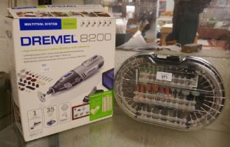 Dremmel 8200 1/35 cordless multi-tool with battery and charger together with a Parkside accessory