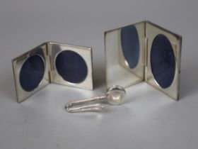 2 hallmarked silver miniature folding photo frames together with a hallmarked silver napkin clip