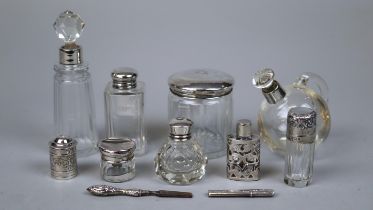 Collection of hallmarked silver topped bottles etc.