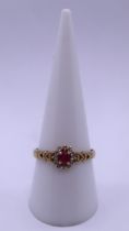 9ct gold ruby and diamond cluster ring - Size R