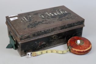 Strong box together with vintage tape measure