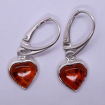 Silver and amber heart-shaped earrings
