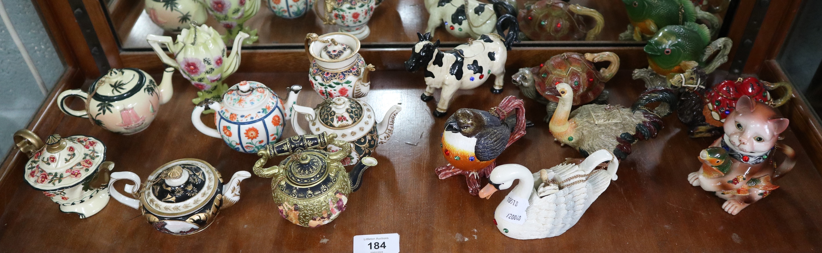 Collection of miniature animals and decorative teapots