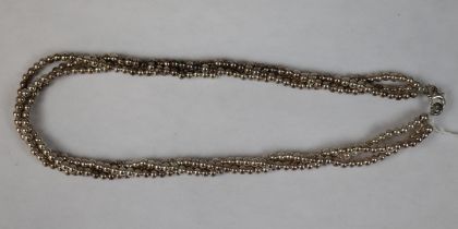 Triple row silver beaded necklace