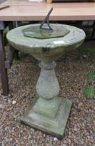 Stone sundial on plinth